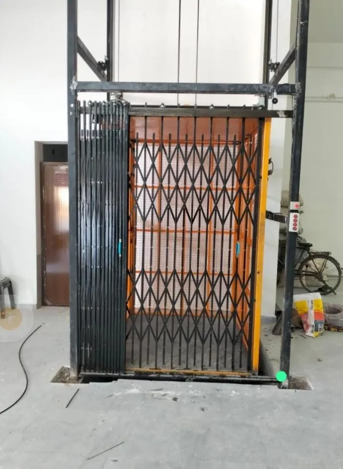 Industrial elevator cabin with collapsible safety gate